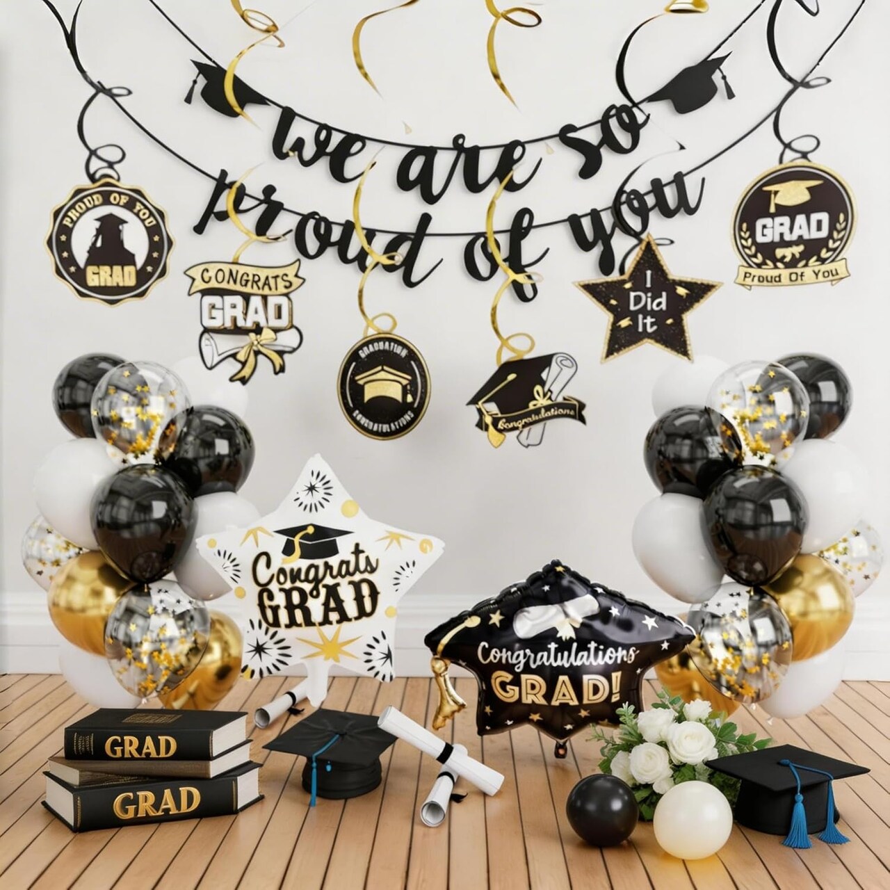 Graduation Party Balloons – Class of 2026 Black & Gold Balloon Set with “We Are So Proud of You” Banner, Grad Cap Foil Balloon, Star Balloons & Hanging Swirls Decor Kit